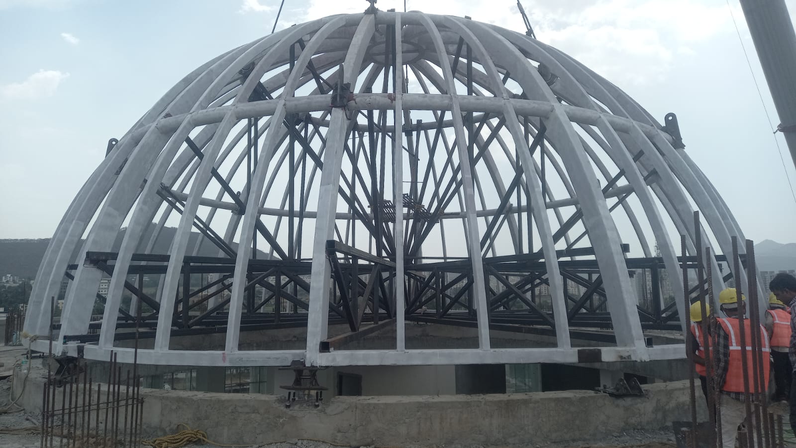 Exposed steel framework of a dome during construction
